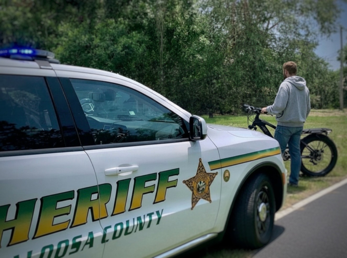 Okaloosa County Sheriff deputy conducting an e-bike traffic stop